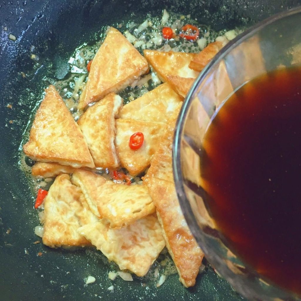 Pour your pre-mixed sauce bowl all over the tofu.