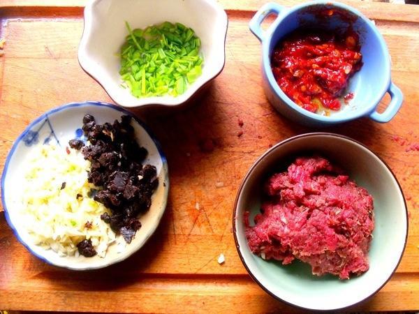 Prep the Meat: Finely mince the beef. Prep the Aromatics . Blanch the Tofu