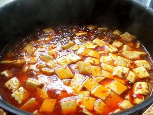 Add Tofu Gently slide the drained, blanched tofu cubes into the sauce.