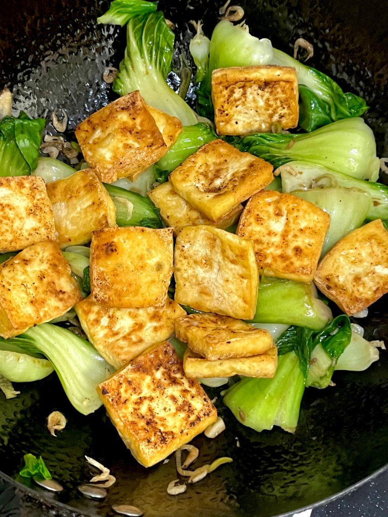 Combine and Season Add the fried tofu back into the pan.