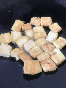 Prepare the Tofu Cut the firm tofu into rectangular pieces, about 1/2 inch thick.