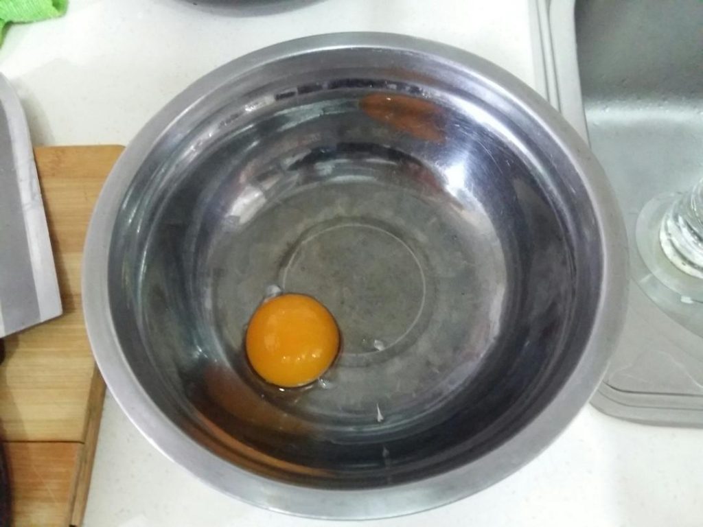 The Egg: Crack the egg into a wide, shallow bowl or container