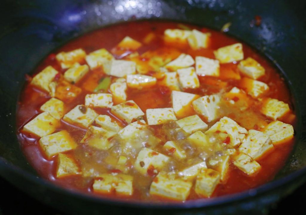 Gently add the blanched tofu cubes.