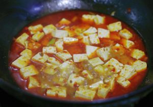 Gently add the blanched tofu cubes.