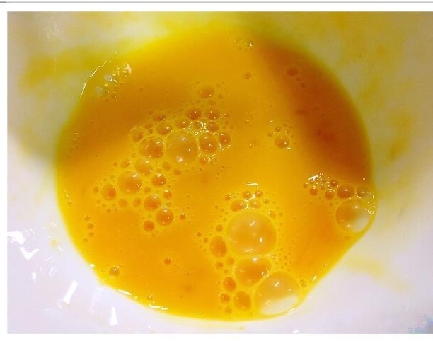 Prep the Egg: Crack the egg into a bowl and beat it thoroughly. You want to break down the whites so it streams easily.