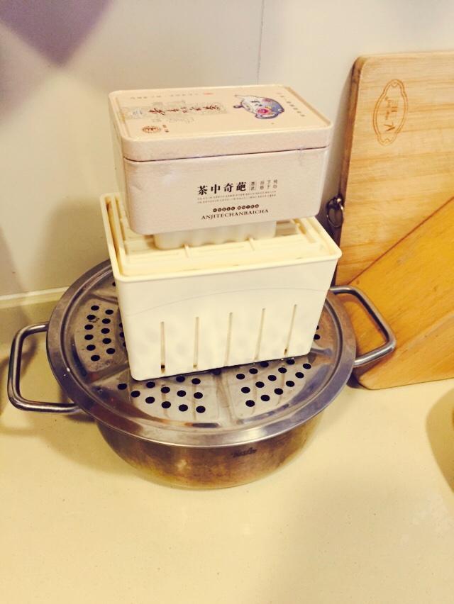 Place a heavy object on top of the lid.