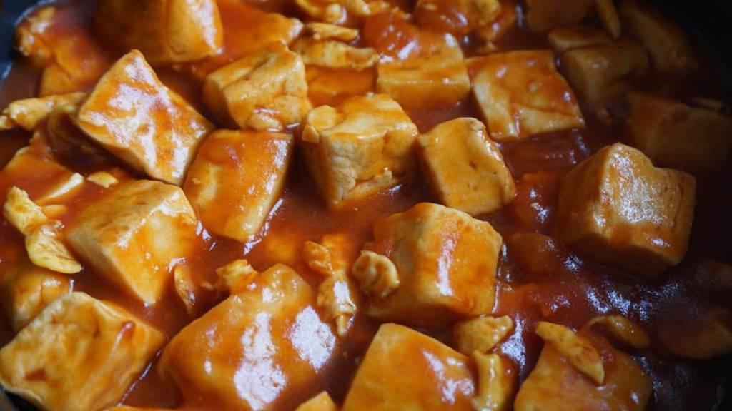Braise Return the cooked eggs and tofu to the pan. Gently toss them in the tomato base to coat.