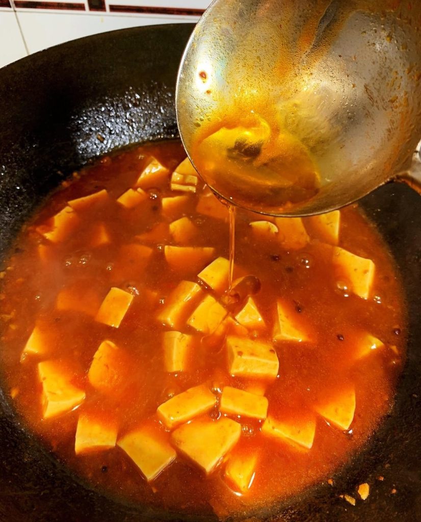 The Finish Pour in 1 tablespoon of Sichuan Peppercorn Oil (Hua Jiao Oil) and give it one final gentle mix.