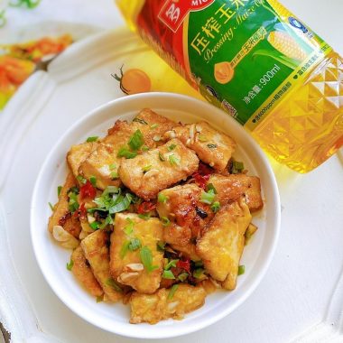 Crispy pan-fried tofu with garlic soy glaze, golden and glossy
