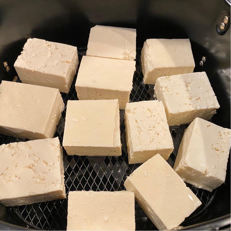 Cut the tofu into pieces and brush both sides