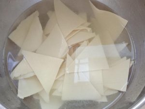 Cut the doupi into triangles and soak them in