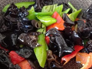 Add the peppers and cook until just done, the