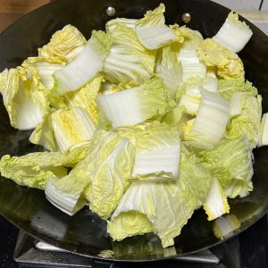 Stir-fry the baby cabbage until soft