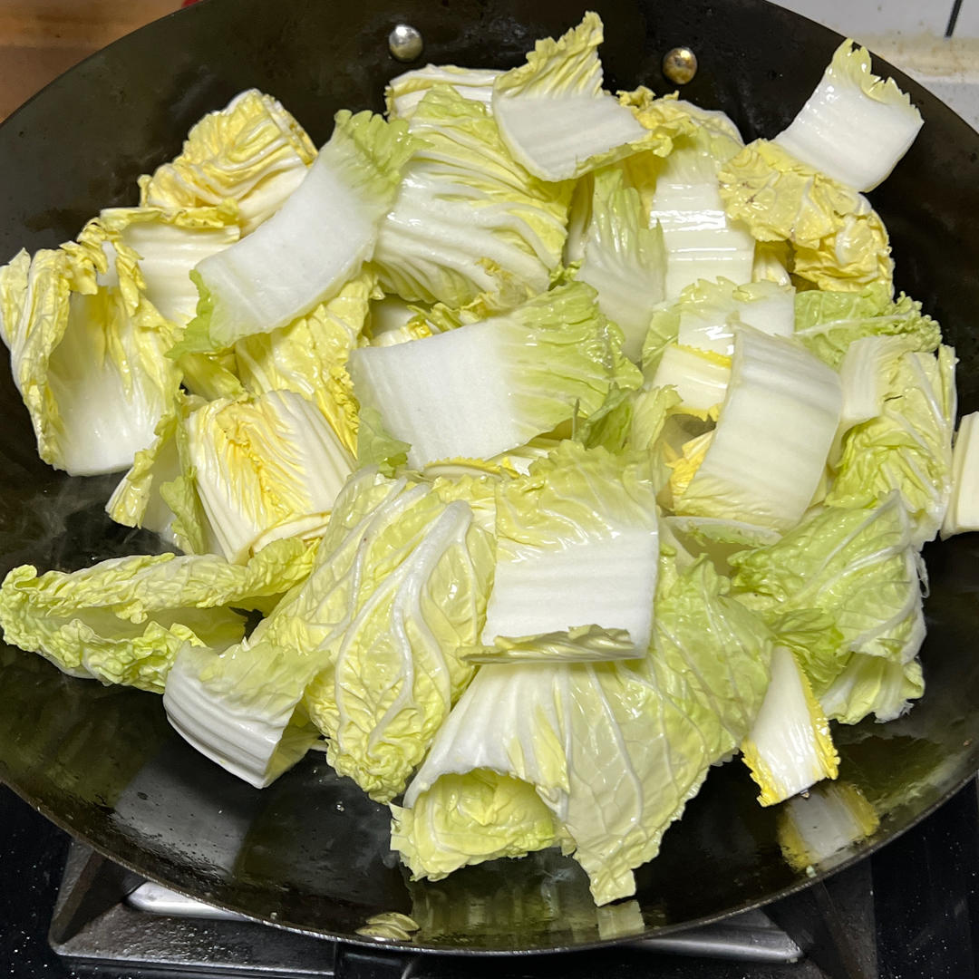 Stir-fry the baby cabbage until soft