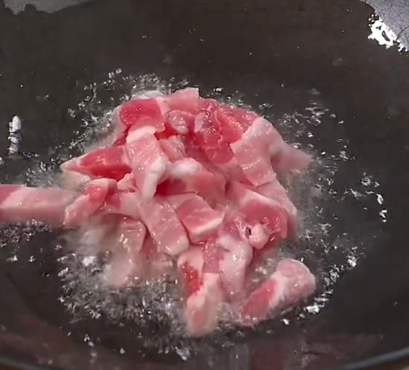 In another pan, heat oil and render the pork