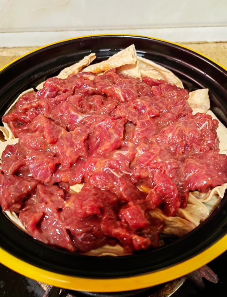 Lay the beef over the yuba, flat