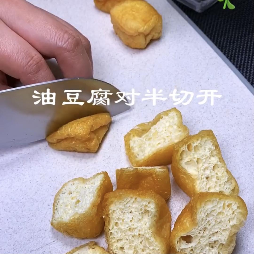 Halve the fried tofu on the diagonal to open