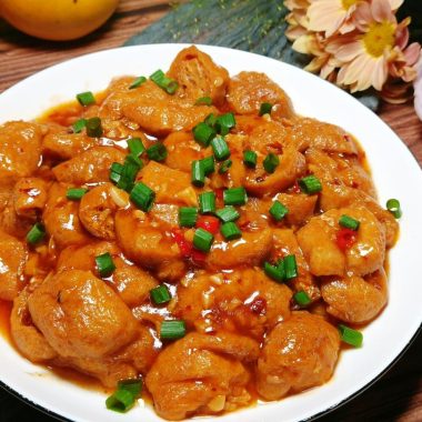 Halved tofu puffs in a glossy Lao Gan Ma sauce