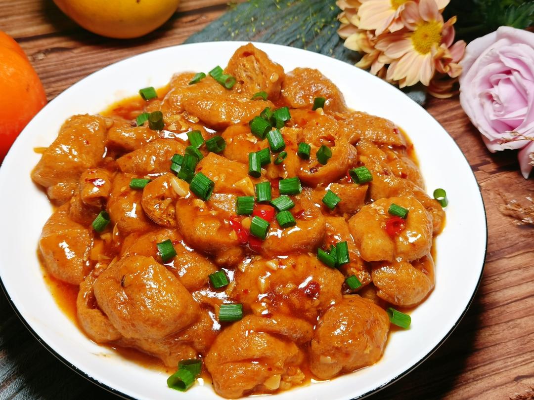 Halved tofu puffs in a glossy Lao Gan Ma sauce