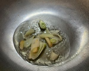 Heat oil in the pan and cook the scallion and