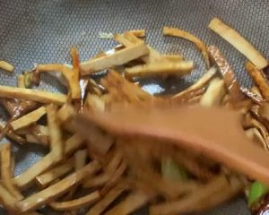 Add the smoked tofu with light soy and toss
