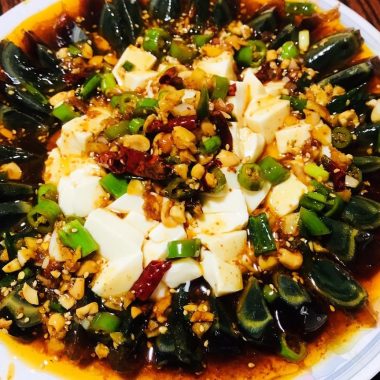 Century eggs and silken tofu under a hot-oil dressing