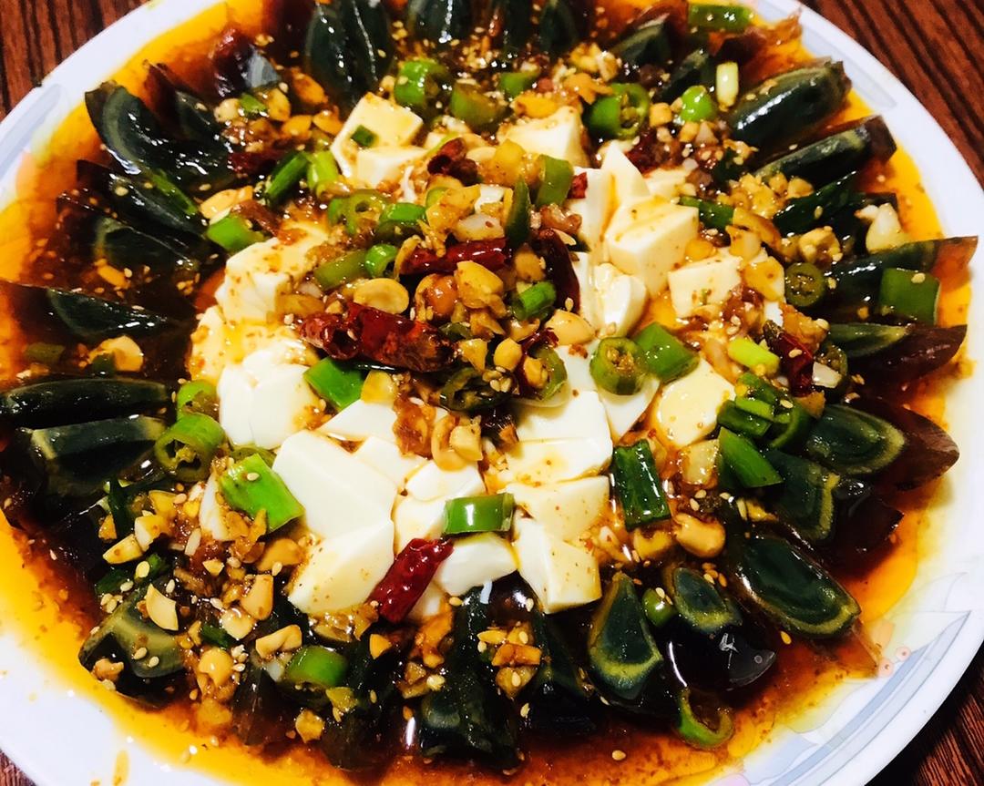 Century eggs and silken tofu under a hot-oil dressing
