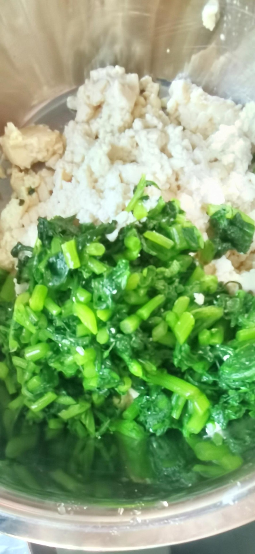 Crush the tofu and cut the greens into pieces