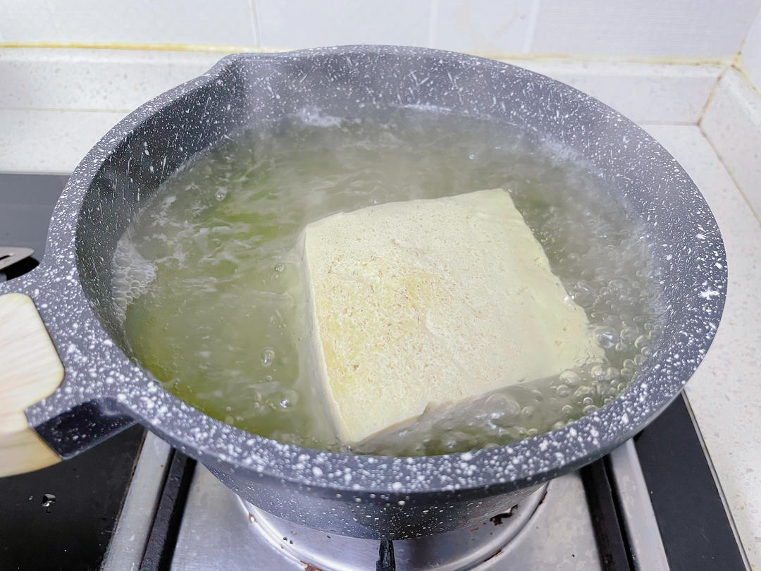 After thawing, boil the tofu 2-3 minutes to l