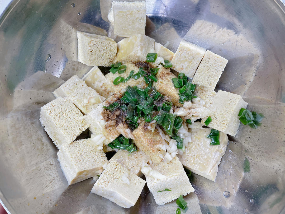 Heat a little oil and pour it over the cumin