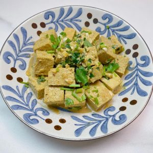 Pour the sauce over the tofu and toss
