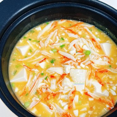 Crab stick and silken tofu in a rich salted-egg broth