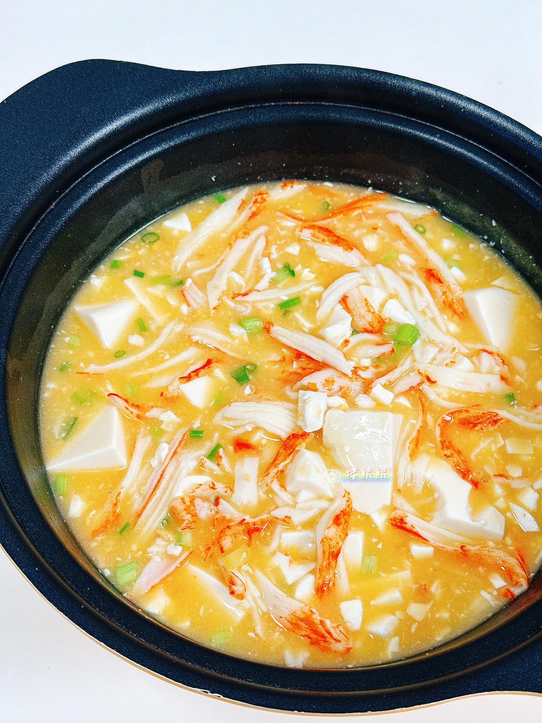 Crab stick and silken tofu in a rich salted-egg broth