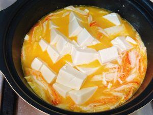 Cut the silken tofu small, add it to the pot,