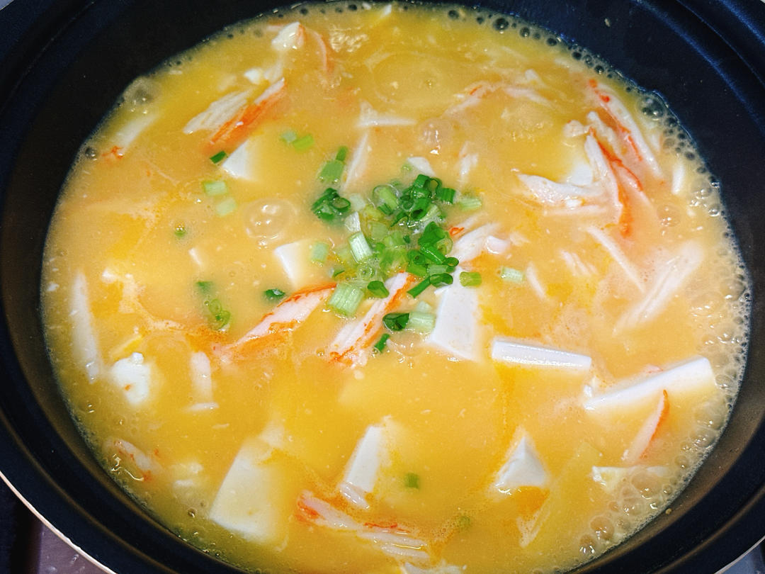 Add the cornstarch slurry and scallion, toss