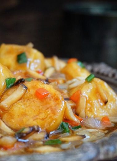 Golden fried egg-tofu rounds tossed with onion and shiitake