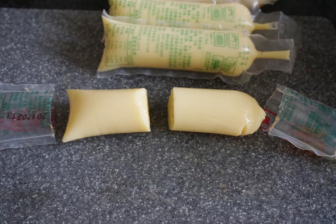Cut the tofu tube (packaging and all) in the