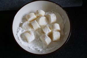 Roll the pieces in the cornstarch bowl until