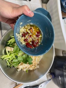 In a big container: the cucumber shreds, the