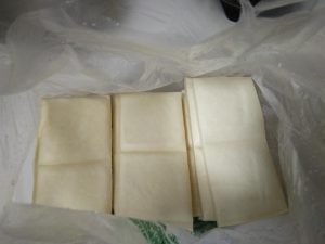 Buy white dried tofu - about 4 jin (4 pounds)