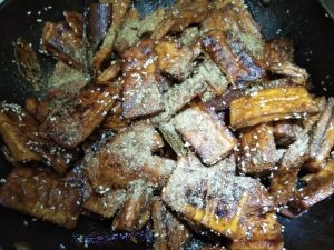 Add the cumin and toss