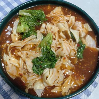 Glossy doupi gravy poured over tofu skin