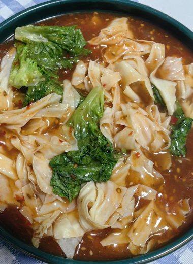 Glossy doupi gravy poured over tofu skin