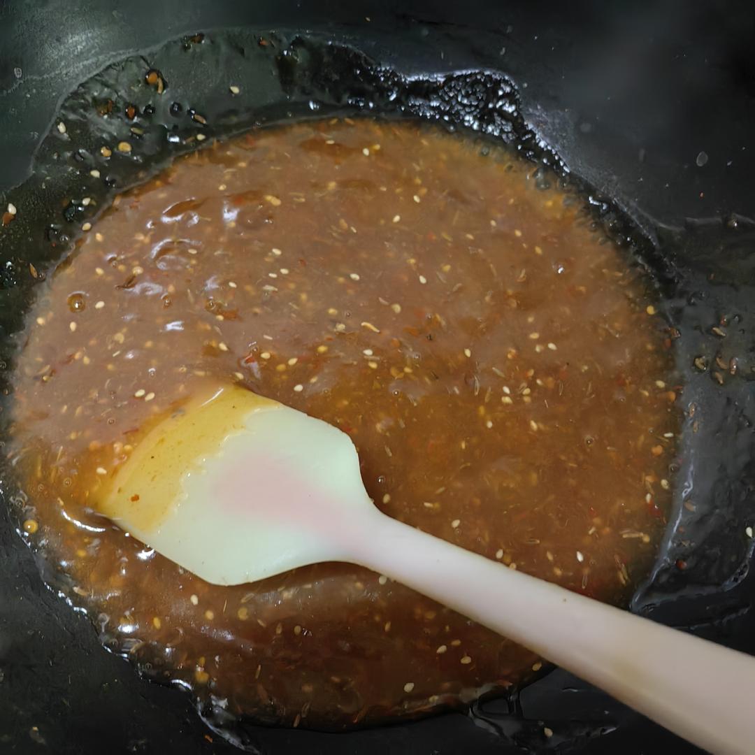Drizzle in the starch water and add sesame an