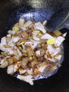 Add dark soy for color and toss evenly