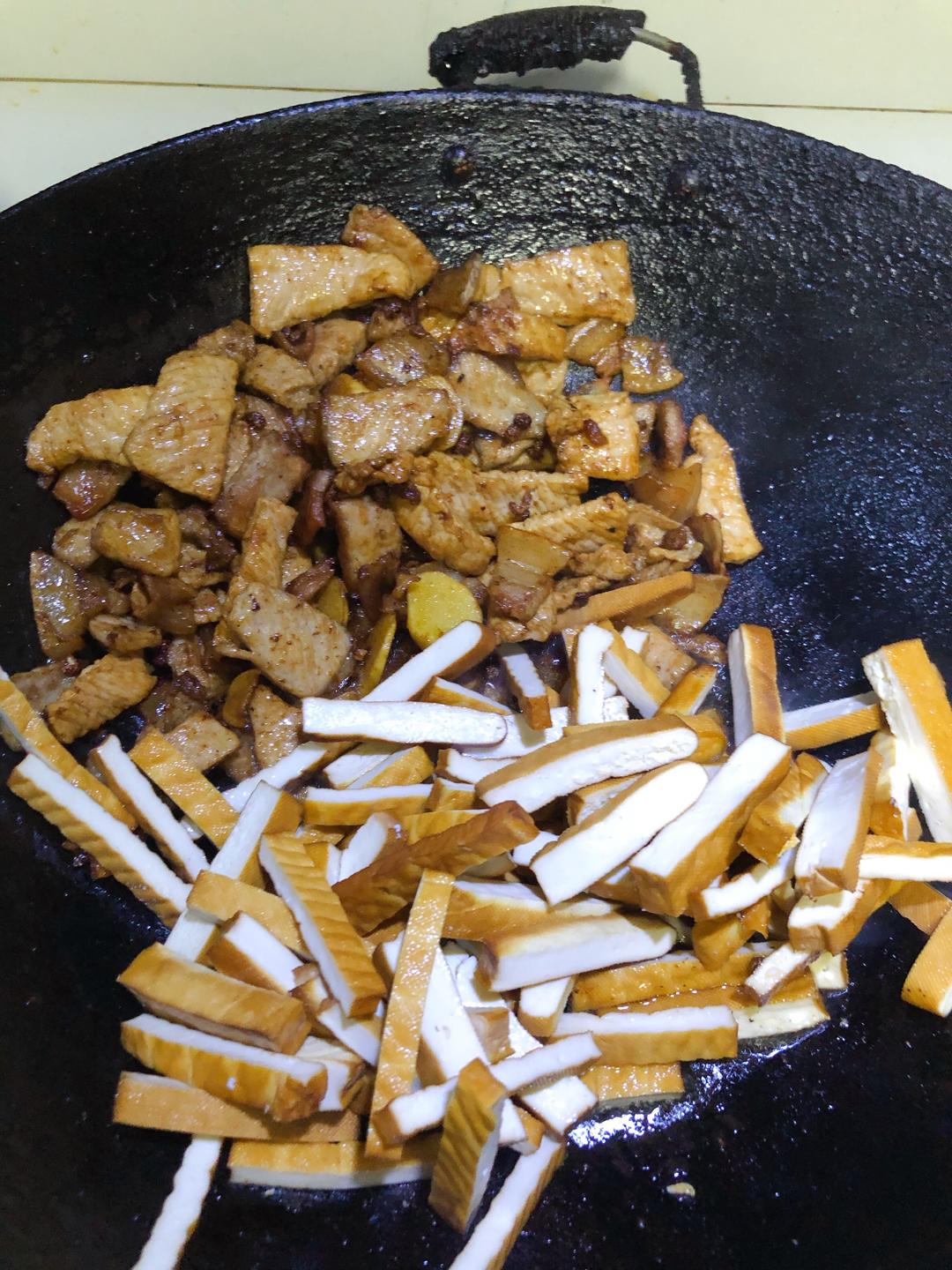 Add the xiang-gan and toss about 2 minutes