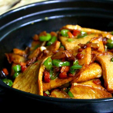 Crisp-edged qianye tofu in a glossy dry-pot sauce