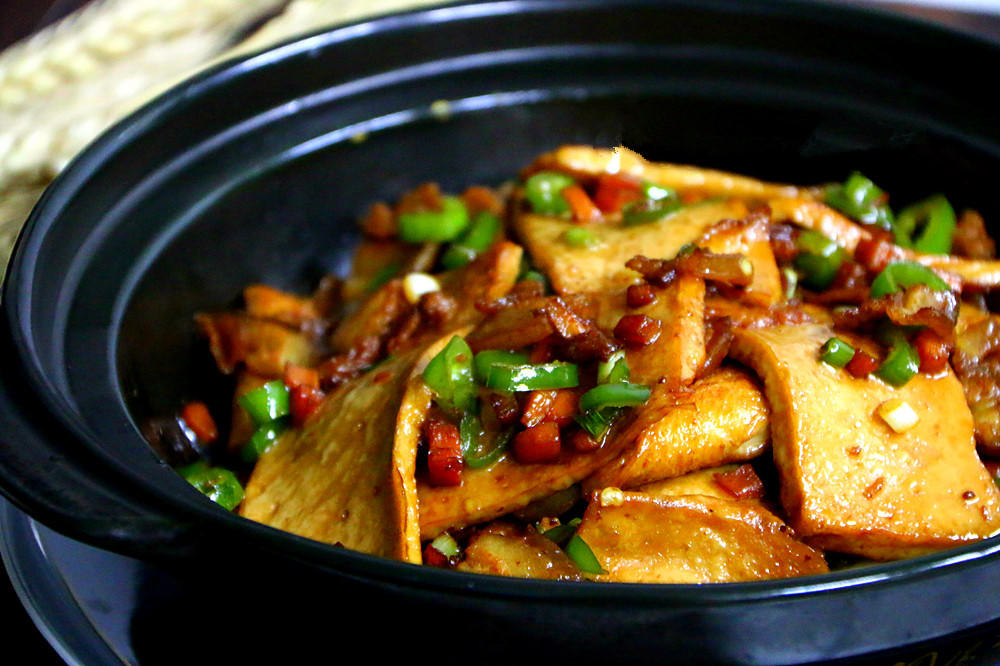Crisp-edged qianye tofu in a glossy dry-pot sauce