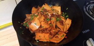 Toss and plate the dry-pot tofu
