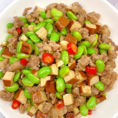 Edamame, xianggan dice, and pork in a glossy toss